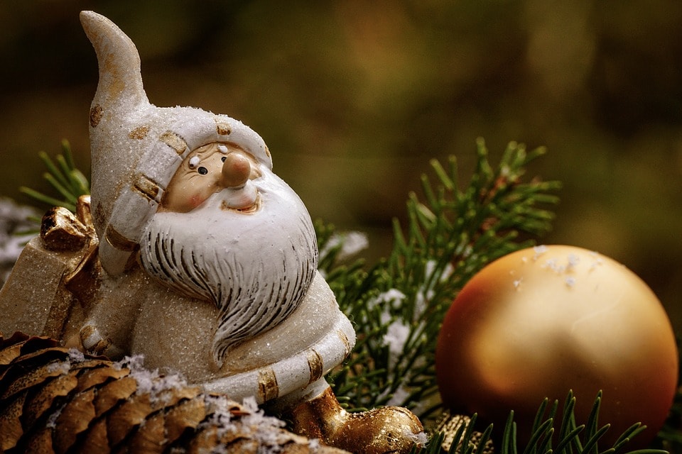 A figurine of Santa is part of a holidays home decor.