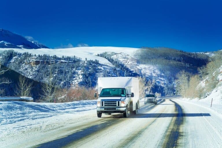 Moving truck on a road in the winter