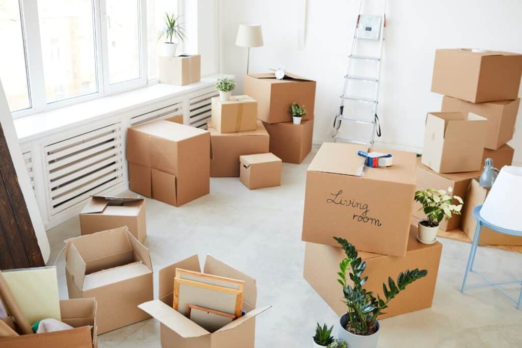 Stacks of moving boxes in a living room